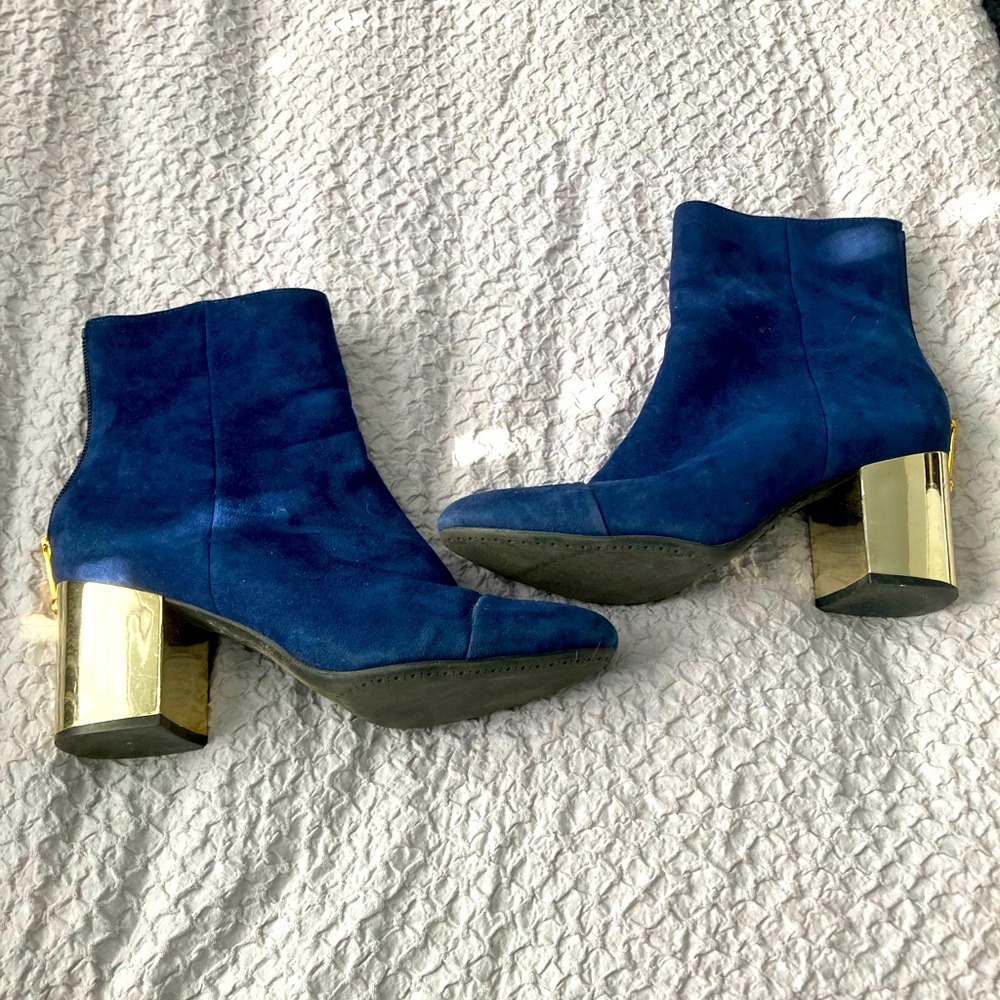 Navy blue suede boots with open zipper on the side. Size 7. Silver heal